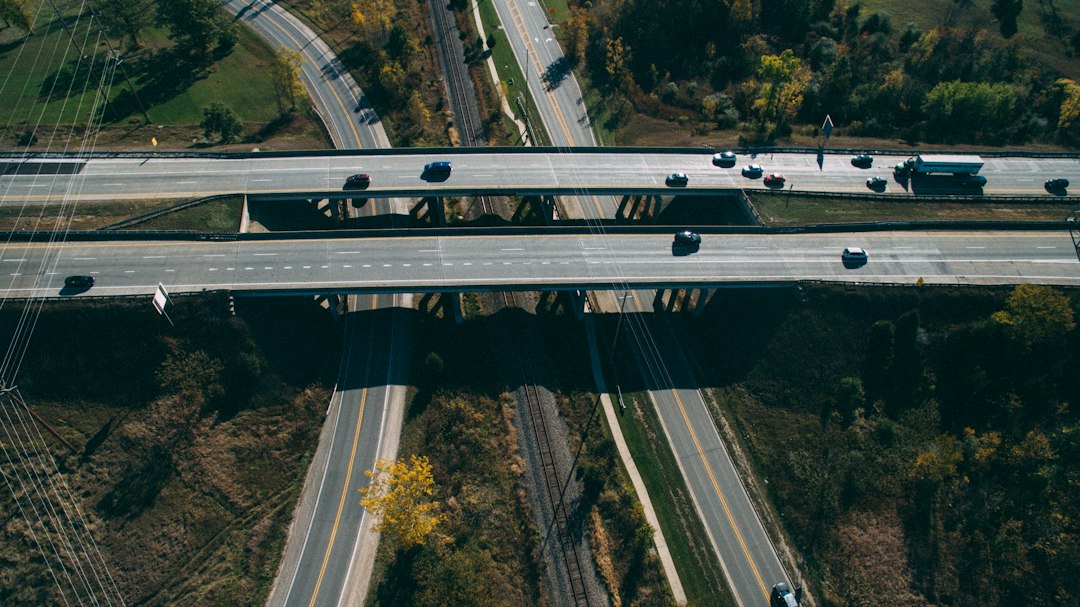 Aerial view of a multi-lane highway with cars converging into a traffic jam, symbolizing a technical SEO bottleneck.